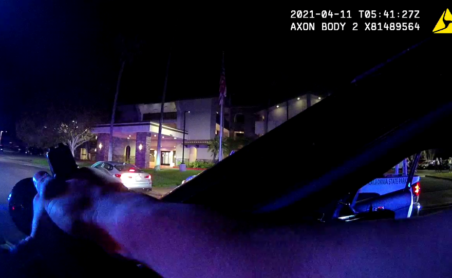 Carlsbad police stage next to a car with a driver who refused to get out, April 10, 2021.