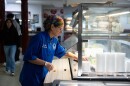 Great Valley School District culinary coordinator Jenifer Halin cleans up the salad bar in the cafeteria at Great Valley High School in Malvern, Pennsylvania.