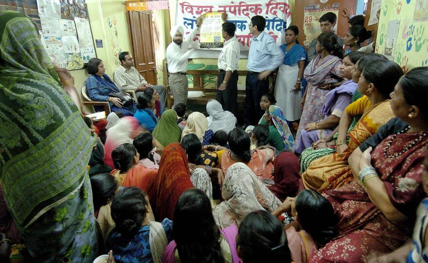 Health workers share information about tuberculosis with residents of aslum neighborhoods in New Delhi. India has the greatest number of TB cases in the world.