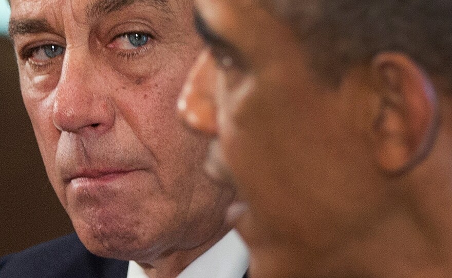 President Obama, with House Speaker John Boehner, speaks to the media in the Cabinet Room of the White House on Sept. 3.