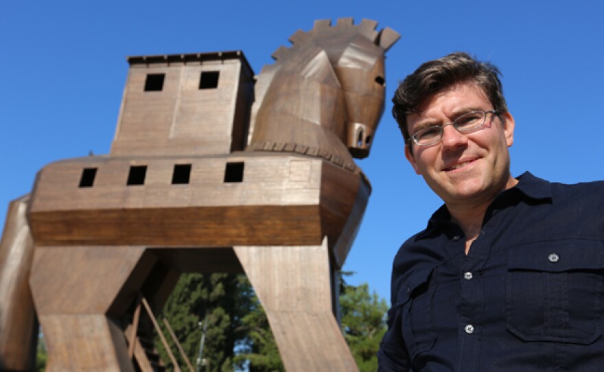 Mark Schwartz, associate professor anthropology (military historian), with Trojan horse replica.