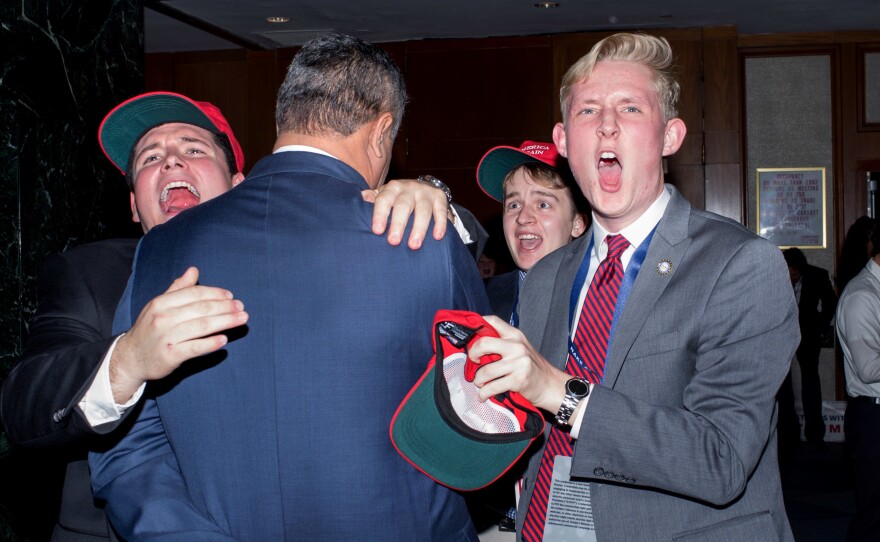 Trump supporters cheer as the election is called in favor of the Republican candidate.