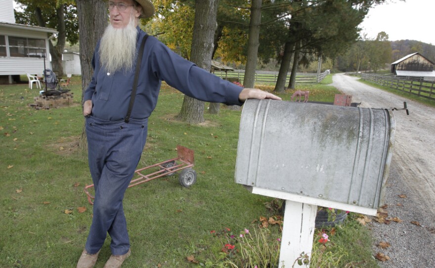 <p>Sam Mullet, father of two of the three men arrested for allegedly going into the home of other Amish and cutting their hair and beards, is seen outside his home in Bergholz, Ohio. Some who have left Mullet's community have accused him of abuse.</p>