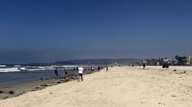 People at Mission Beach on Monday, April 27, 2020, the first day beaches in San Diego reopen with restrictions.