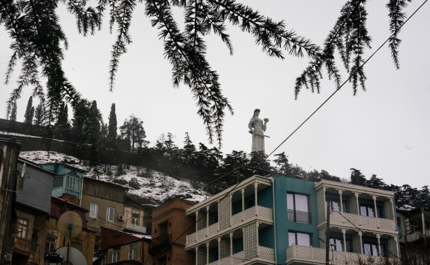 The Mother of Georgia statue looms over Tbilisi, welcoming visitors with a jug of wine in one hand and a sword in the other.