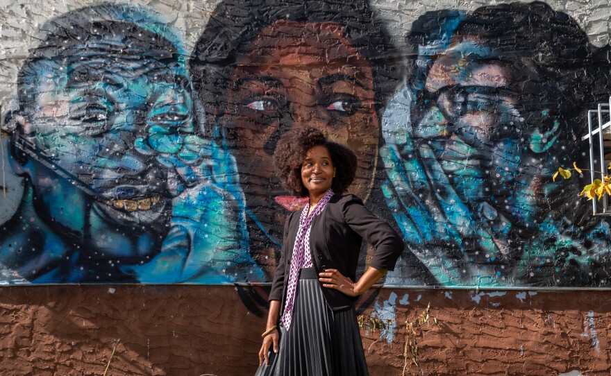 Keitra Bates stands outside of the original location of Marddy's in Atlanta. It's a shared kitchen where home cooks can prepare their goods, and collectively market them.