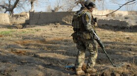 Service member patrolling Zhary district in Afghanistan.