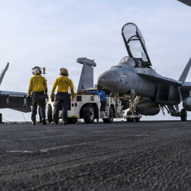 U.S. Sailors tow an EA-18G Growler, assigned to Electronic Attack Squadron (VAQ) 133, on the flight deck of Nimitz-class aircraft carrier USS Abraham Lincoln (CVN 72), July 30, 2026.