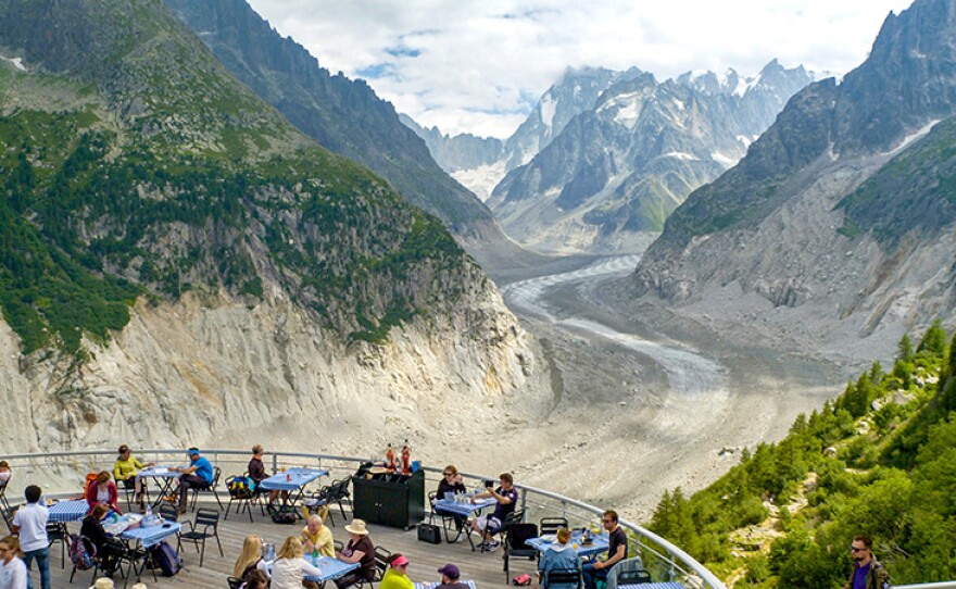 Café terrace overlooking the shrinking Mer de Glace glacier above Chamonix, France.