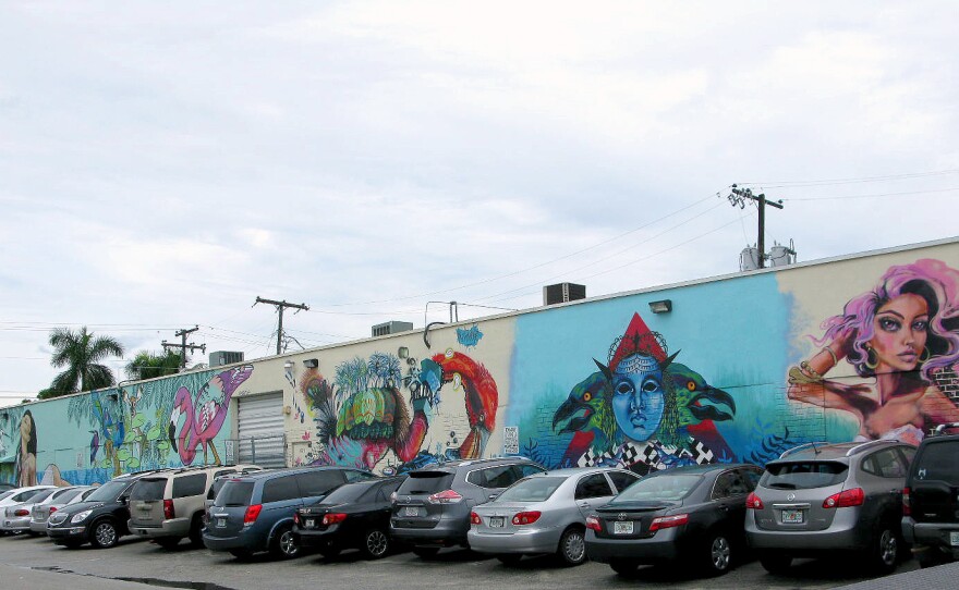 Colorful street art brightens the otherwise drab warehouses in Hialeah, Fla., where Cuban and Haitian immigrants labor inside binding books, making furniture and sewing clothes.