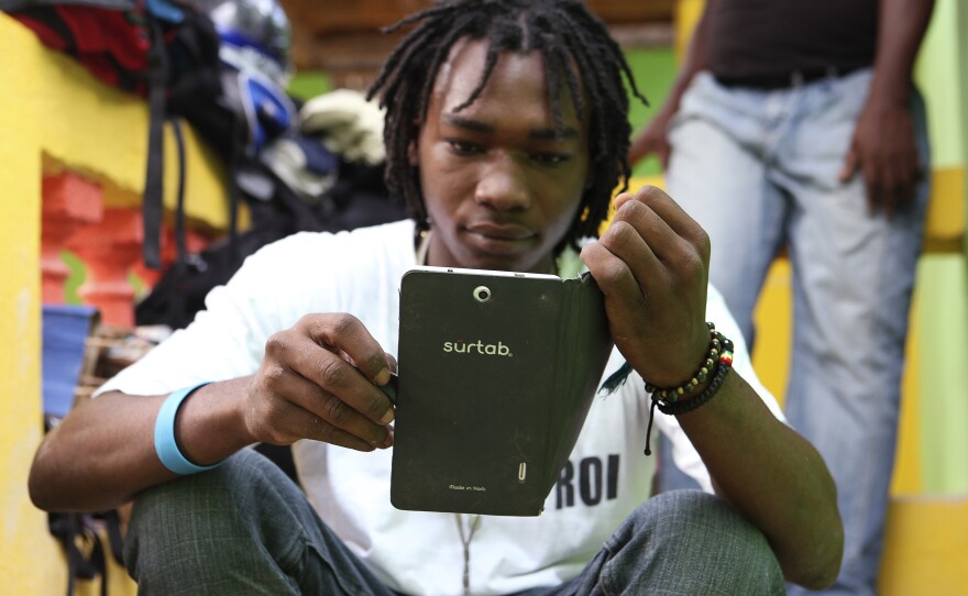 Haitian artist Richard Josue uses a Surtab tablet.