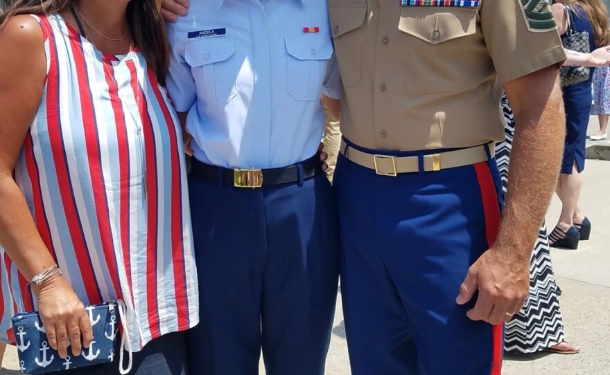 Undated photo of Mike Andela, a Marine Corp veteran, with his wife Heidi Andela (left), and daughter Alyssa Andela (middle).
