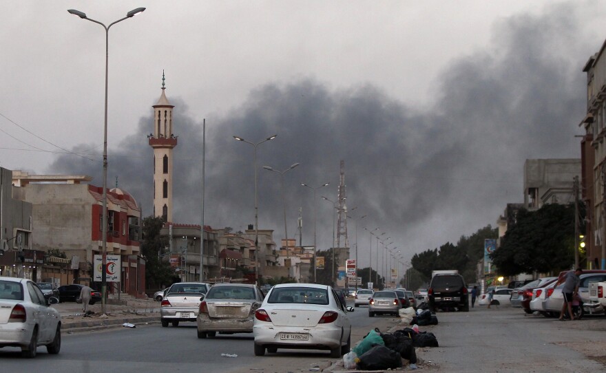 Smoke billows from buildings during clashes between Libyan security forces and armed Islamist groups in the eastern coastal city of Benghazi on Saturday. There has been frequent fighting in and around the capital, Tripoli, as well as Benghazi and other parts of the east.