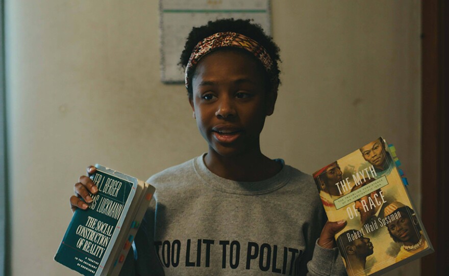 Alicia, a junior at T.M. Landry College Prep, shows off her reading list.
