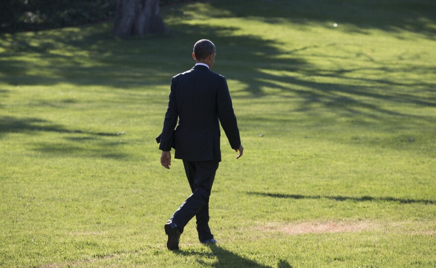 President Obama walks from the White House to board Marine One on Friday. In an interview Thursday with NBC News, he apologized for breaking a promise regarding the Affordable Care Act.