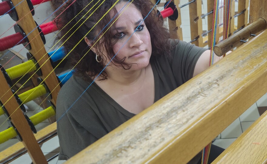 Lilliana Moretti, 28, works on a loom in one of San Patrignano's textile workshops. She said the structured work schedule and sense of community in the Italian community helps people like herself heal with addiction. "This place has humanity, it has compassion," she said.