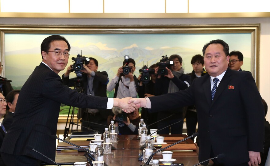 South Korean Unification Minister Cho Myoung-gyon, left, shakes hands with the head of North Korean delegation Ri Son-Gwon before their meeting at the Panmunjom in the Demilitarized Zone on Tuesday in Panmunjom, South Korea.