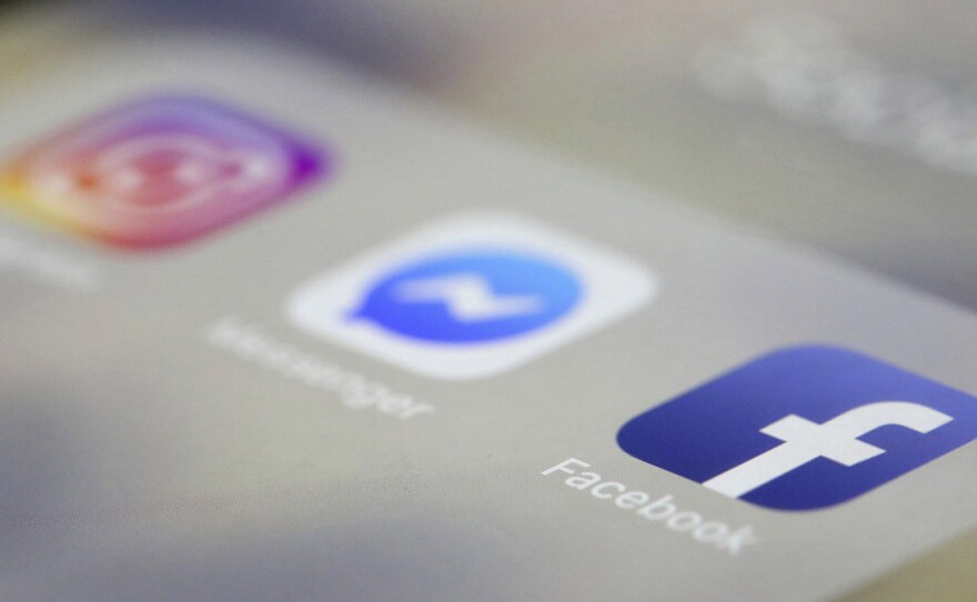 Facebook, Messenger and Instagram apps are displayed on an iPhone, April 8, 2019.