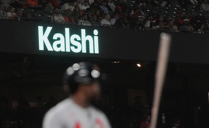A Kalshi sign is displayed at Oracle Park during a baseball game between the San Francisco Giants and the St. Louis Cardinals, Tuesday, Sept. 8, 2026, in San Francisco.