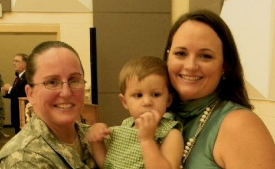Army Lt. Col. Heather Mack, wife Ashley Broadway, and son.