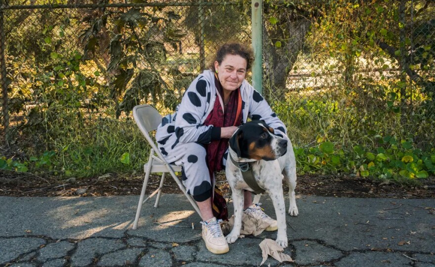 Lee Alirez sits with her dog on Jan. 28, 2025.