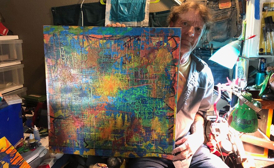 Ron Patterson shows off his artwork in his apartment in this photo taken Aug. 7, 2019. 