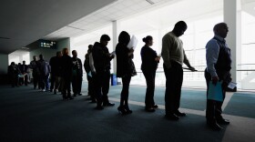 Jobseekers line up to enter a career fair in Los Angeles. Last month, the nation's unemployed totaled 15.1 million.