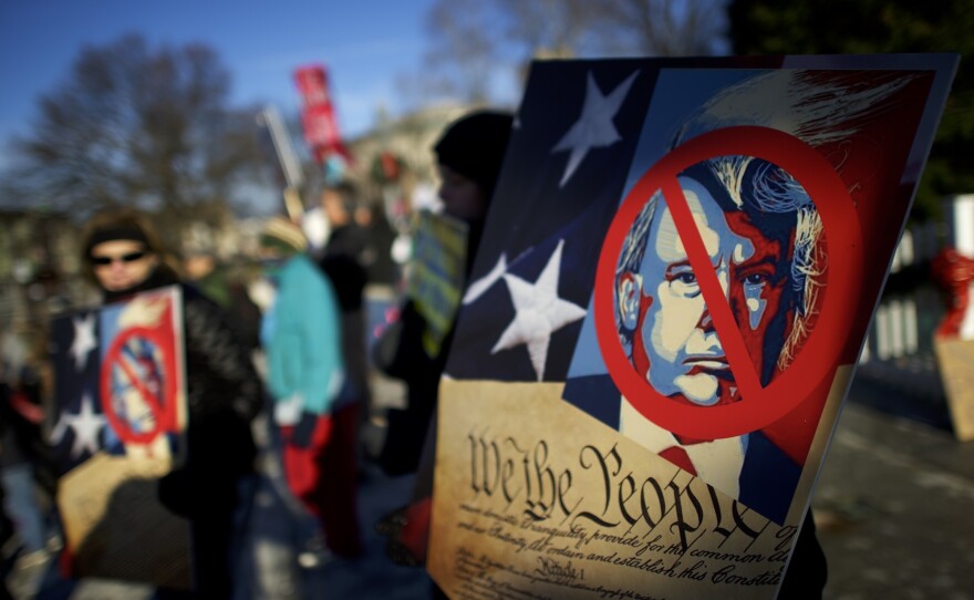Anti-Donald Trump protesters rally outside the Pennsylvania Capitol Building before electors arrive to cast their votes on Monday in Harrisburg.