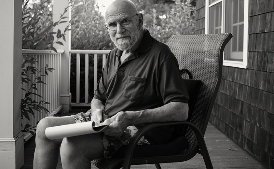 Oliver writing on porch, 2015, N.Y.