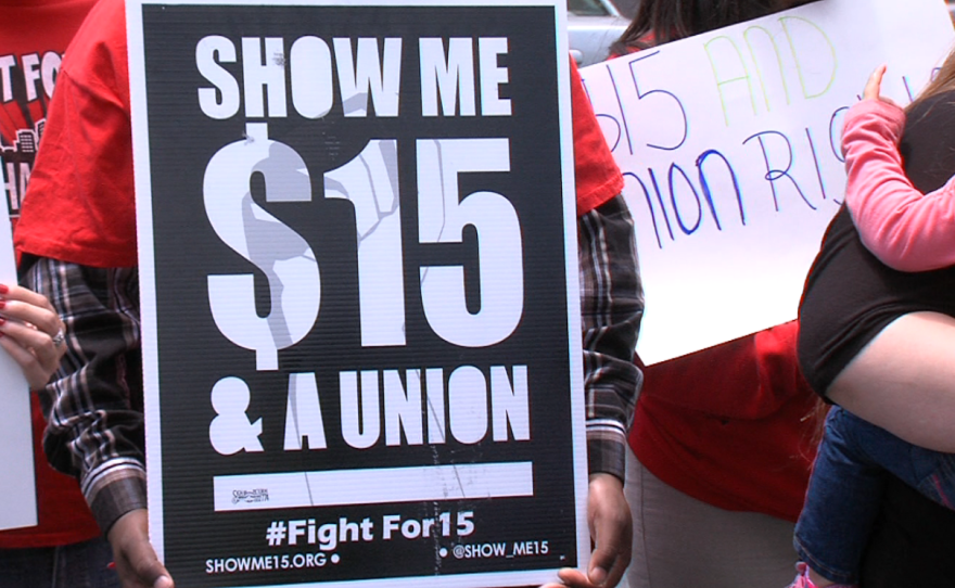 A sign asks for $15 minimum wage outside the McDonald's on Tierrasanta Boulevard in San Diego, June 5, 2015.