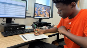 Sophomore Damola Kukoyi fills out a worksheet in his AP Business with Personal Finance class at Hoover High School on October 6, 2026.
