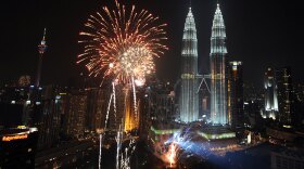 Fireworks explode near Malaysia's landmark Patronas Twin Towers during the New Year 2010 celebrations in Kuala Lumpur.