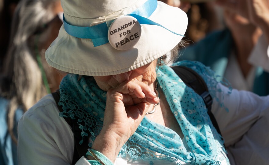 A mourner reacts during Vivian's funeral service Thursday.
