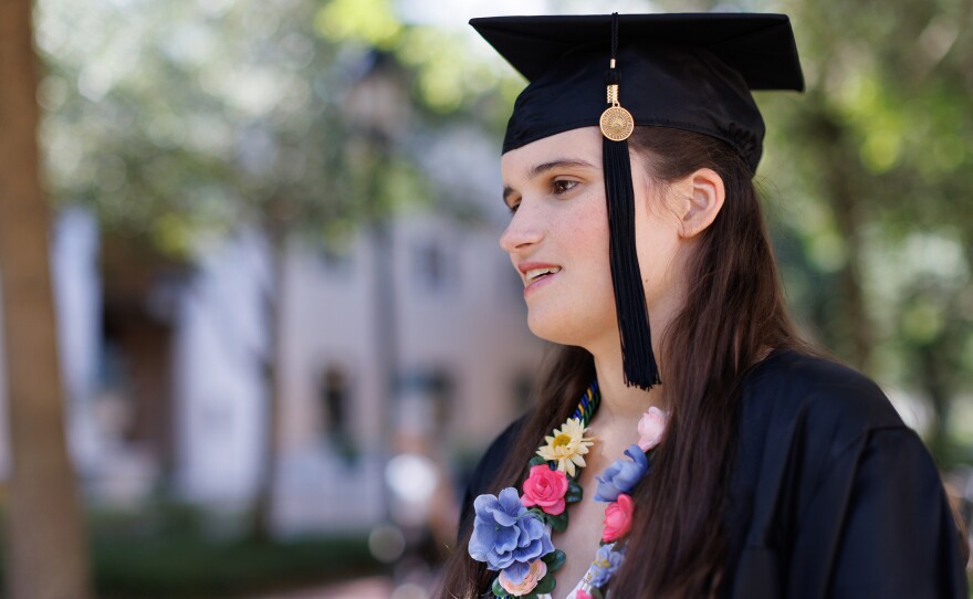 "God gave you a voice. Use it," Elizabeth Bonker told her fellow graduates. "And no, the irony of a nonspeaking autistic encouraging you to use your voice is not lost on me."
