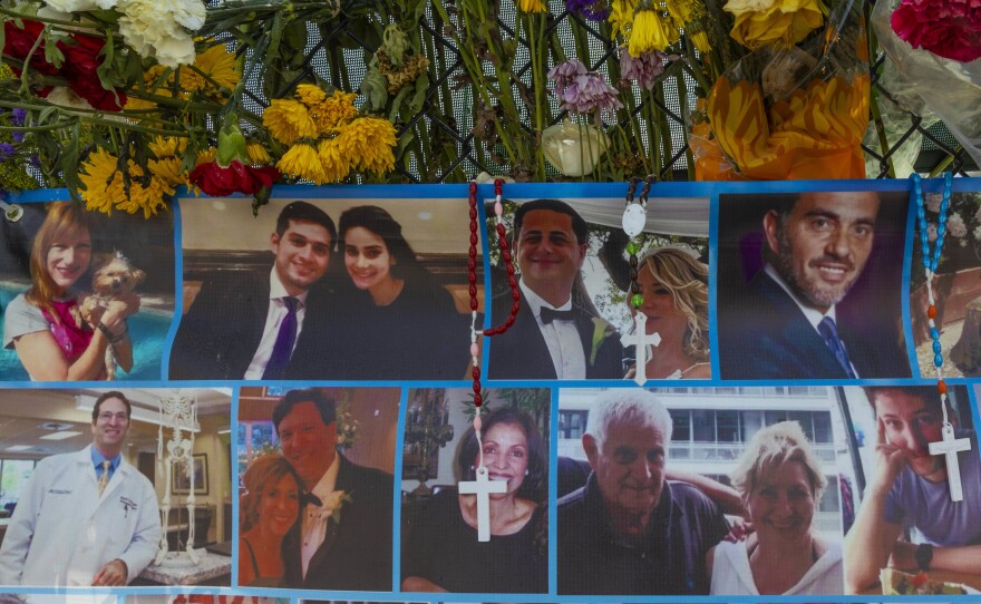 A memorial shows some of the people still missing from the Champlain Towers South condo collapse in Surfside, Fla.