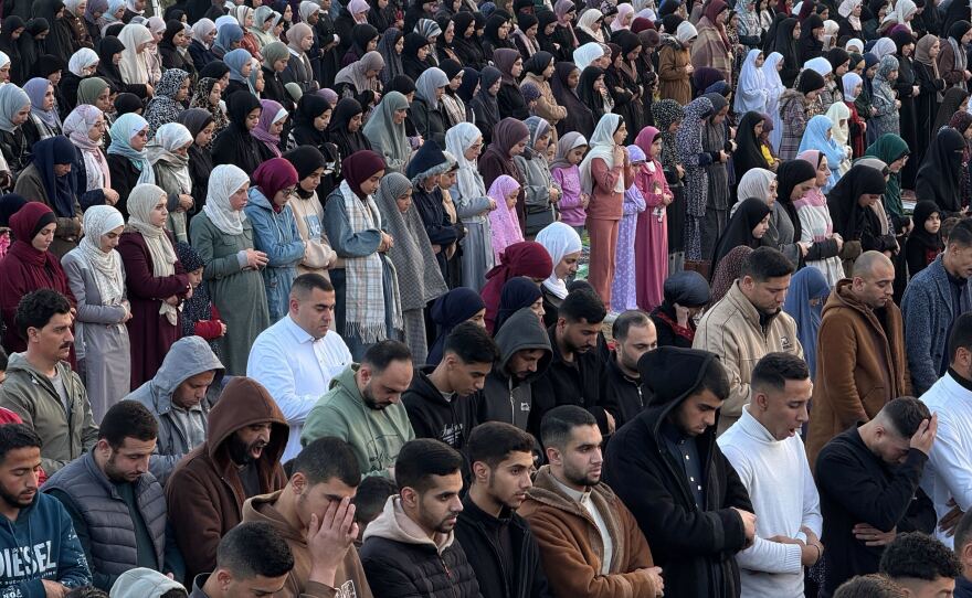 People pray on Eid in Gaza City on Friday.