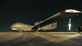 An RQ-4 Global Hawk sits on the runway before beginning a nighttime mission. The aircraft is unmanned, and is used to capture imagery from high altitudes. (Courtesy photo/John Schwab)
