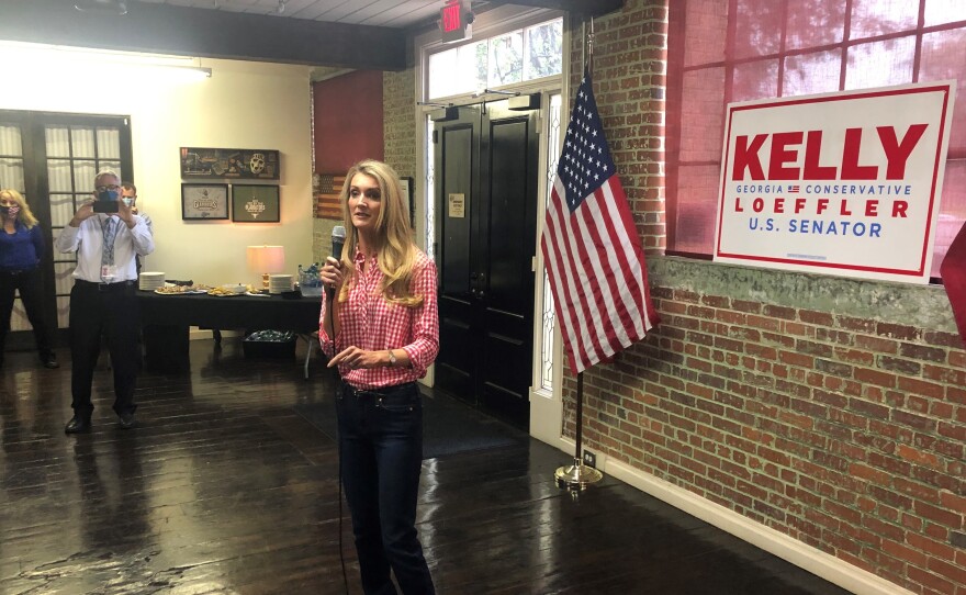 Republican Sen. Kelly Loeffler campaigns in Buford, Ga., telling supporters she's 100% with President Trump.