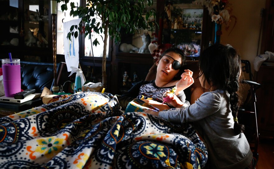 When she could no longer move her legs, Lola was confined to her great-grandfather's reclining chair. Her sister, Izel, still too young for school, would pass the days with Lola.