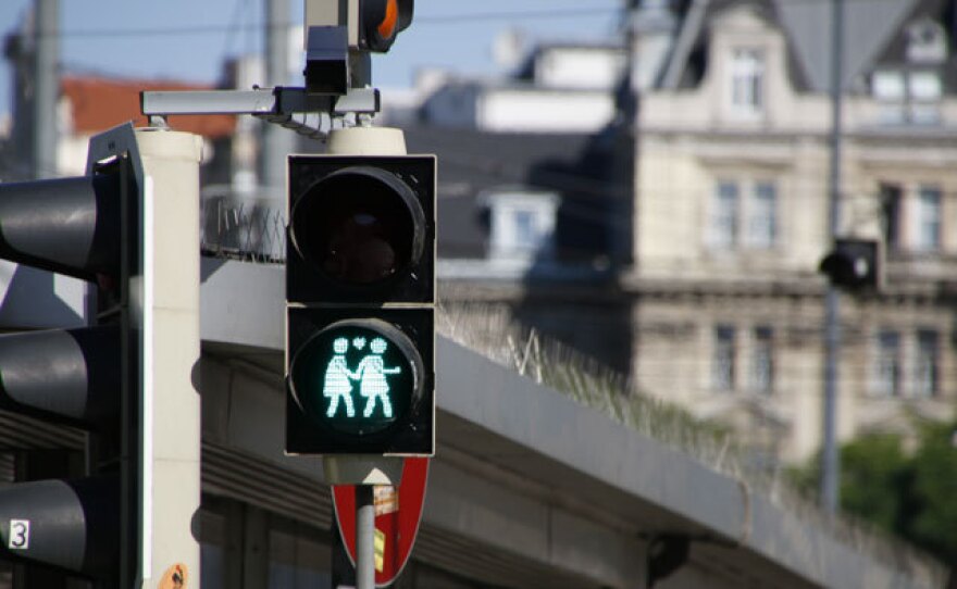 A crosswalk signal in Vienna indicates pedestrians can now cross.