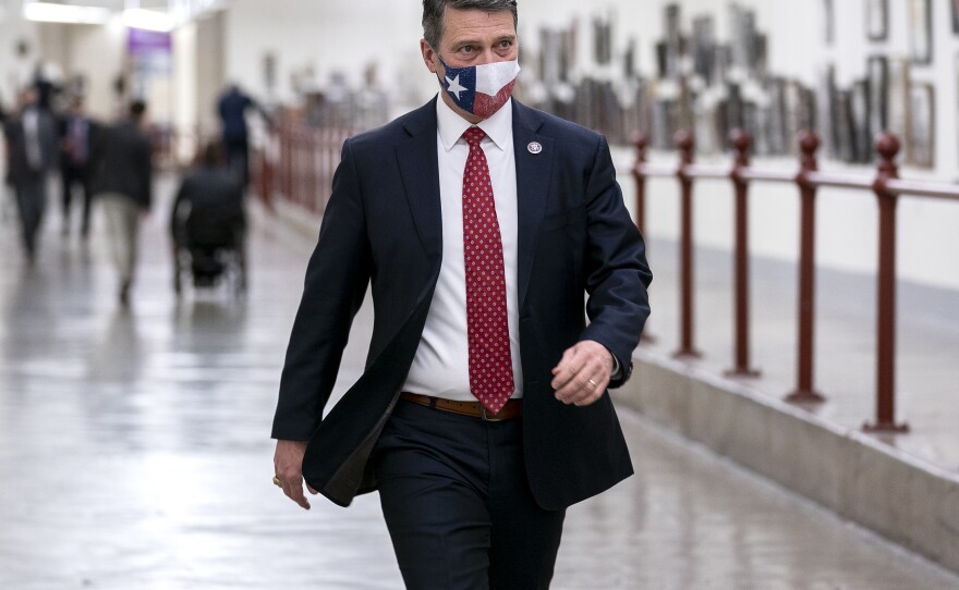 Rep. Ronny Jackson wears a protective mask while walking through the Canon Tunnel to the U.S. Capitol on January 12, 2021, days after a violent mob broke through police barriers trying to overturn the presidential election.