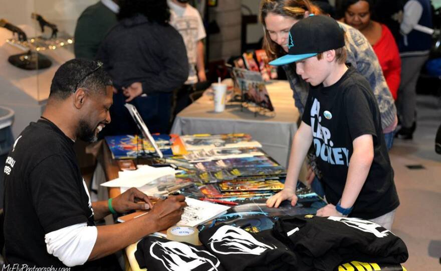 Comics creator Kethan Jones at his KID Comics table at Black Comix Day when it was held previously at the Malcolm X Library. Feb. 2019