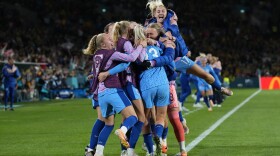 England's team players celebrate after Alessia Russo scored her side's third goal during the Women's World Cup semifinal soccer match between Australia and England at Stadium Australia in Sydney, Australia, Wednesday, Aug. 16, 2023.