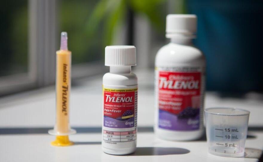 Infants' Tylenol comes with a dosing syringe, while Children's Tylenol has a plastic cup. Both contain the same concentration of the active ingredient, acetaminophen.