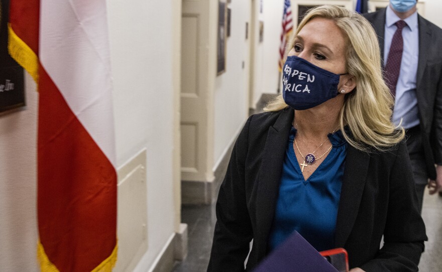 Rep. Marjorie Taylor Greene, R-Ga., leaves her office at the U.S. Capitol on Wednesday. House Majority Leader Steny Hoyer said the House will vote Thursday on whether to strip her of her committee assignments.