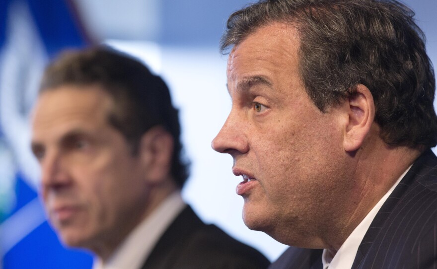 New York Gov. Andrew Cuomo, left, listens Friday as New Jersey Gov. Chris Christie talks at a news conference in New York. The governors announced a mandatory quarantine for people returning to the United States through airports in New York and New Jersey who are deemed to be at "high risk" for Ebola.