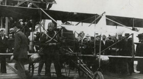 In 1911, Eugene Ely becomes the first to lift off and land on the deck of a aircraft carrier.