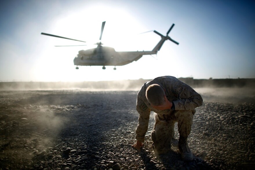 The Marines of the 2nd Battalion, 8th Regiment — known as "America's Battalion" — have been fighting the Taliban in southern Afghanistan's Helmand province since July. Here, Lt. Col. Christian Cabaniss, the battalion commander, covers his eyes and hits the ground as a Marine helicopter lifts off from Forward Operating Base Delhi.