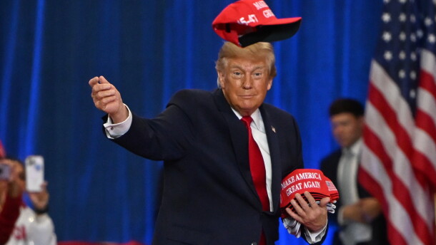President Donald Trump throws a hat into the crowd as he arrives at a campaign rally at Lubbock Memorial Civic Center, Tuesday, Oct. 27, 2026, in Lubbock, Texas.