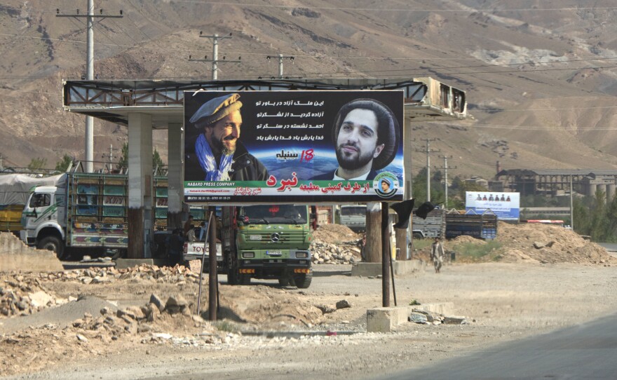 A banner in the Panjshir Valley portrays of Ahmad Massoud and his father with a slogan "You dream of a free country, free thanks to your army, Ahmad is by your side, may God protect you."